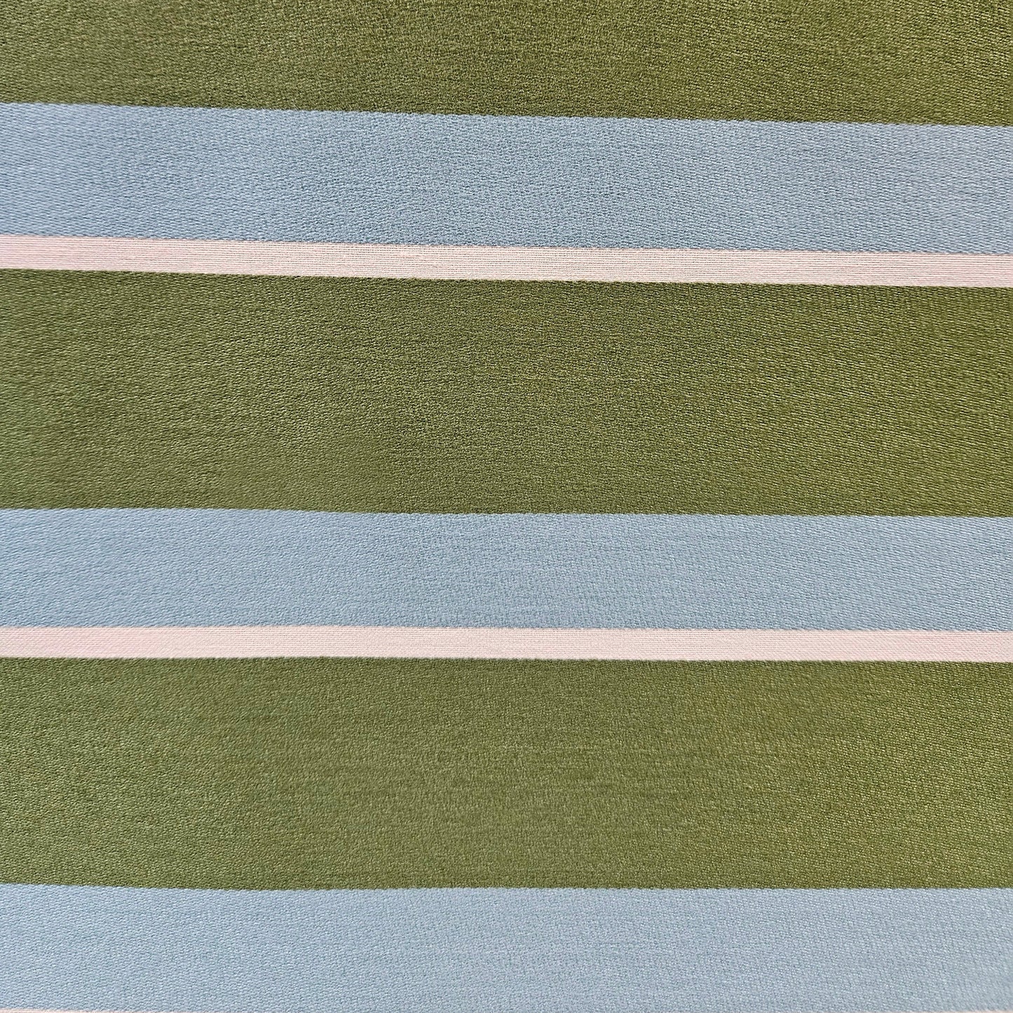 Close-up of fabric with horizontal stripes in green, blue, and beige.