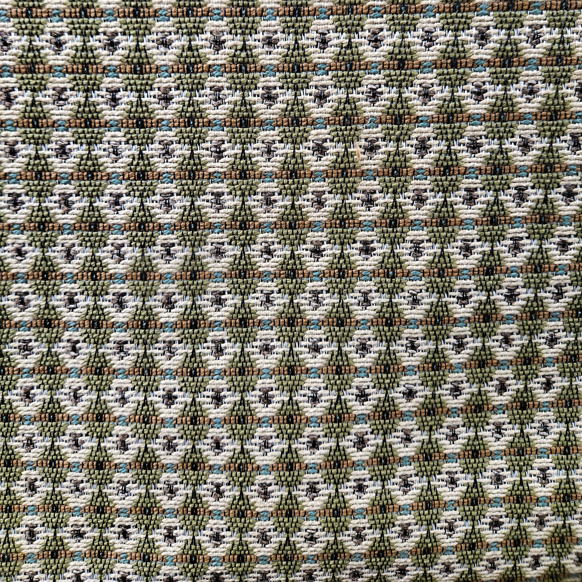 Patterned fabric with geometric design in green, brown, and white