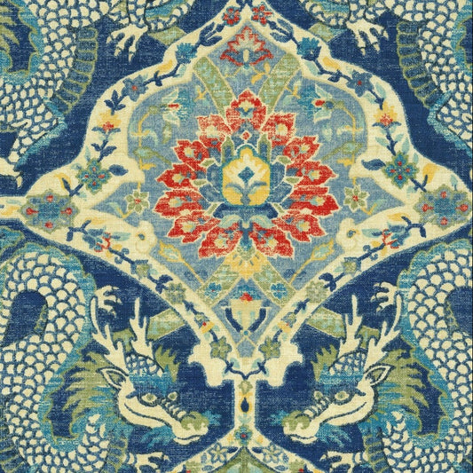 Decorative fabric with intricate dragon and floral pattern on a blue background